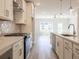 Modern kitchen boasts white cabinets, quartz counters, and stainless appliances at 1995 Deco Dr, Kennesaw, GA 30144