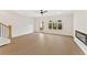Bright living room features wood floors, a fireplace, and a glass door leading to the outside patio at 1995 Deco Dr, Kennesaw, GA 30144