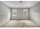 Neutral bedroom with two windows providing ample light at 3171 Blairhill Ct, Atlanta, GA 30340