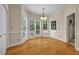 Charming breakfast nook with hardwood floors, large windows, and a door to the backyard at 3171 Blairhill Ct, Atlanta, GA 30340