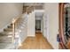 Grand foyer entry with hardwood flooring, staircase and view to formal living room at 3171 Blairhill Ct, Atlanta, GA 30340