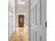 Grand foyer entry with hardwood flooring, high ceilings, and a decorative wood front door at 3171 Blairhill Ct, Atlanta, GA 30340