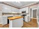 Bright kitchen with island, white cabinetry, and stainless steel appliances at 3171 Blairhill Ct, Atlanta, GA 30340