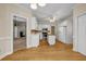 Open concept kitchen with white cabinets, stainless steel appliances and hardwood floors at 3171 Blairhill Ct, Atlanta, GA 30340
