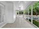 Spacious screened-in porch with a ceiling fan and natural light at 3171 Blairhill Ct, Atlanta, GA 30340