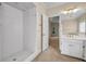 Bathroom featuring a walk-in shower, vanity area and view to the backyard at 3171 Blairhill Ct, Atlanta, GA 30340