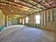 Unfinished basement with concrete floors and walls, exposed ceiling insulation, and natural light from basement windows at 3745 Reserve Overlook (#30) Way, Cumming, GA 30041