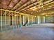 Unfinished basement with concrete floors and walls, exposed ceiling insulation, and staircase access at 3745 Reserve Overlook (#30) Way, Cumming, GA 30041