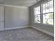 Bedroom with plush carpet, natural light, and neutral paint at 3745 Reserve Overlook (#30) Way, Cumming, GA 30041