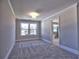 Bright bedroom with neutral walls, plush carpet, and an ensuite bathroom at 3745 Reserve Overlook (#30) Way, Cumming, GA 30041