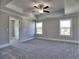 Spacious bedroom featuring a trey ceiling with fan, neutral walls, and large windows for natural light at 3745 Reserve Overlook (#30) Way, Cumming, GA 30041