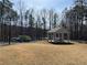 Community area with a picnic shelter, rows of colorful kayaks, and a view of the water in the distance at 3745 Reserve Overlook (#30) Way, Cumming, GA 30041