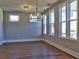 Bright dining room with ample natural light and a modern chandelier at 3745 Reserve Overlook (#30) Way, Cumming, GA 30041