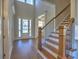 Bright foyer with hardwood floors and staircase, leading to the front door at 3745 Reserve Overlook (#30) Way, Cumming, GA 30041