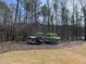 Assorted kayaks are displayed on a rack, offering outdoor adventure and lake access for residents in a lakeside community at 3745 Reserve Overlook (#30) Way, Cumming, GA 30041