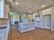 Modern kitchen featuring a central island, stainless steel appliances, and stylish pendant lighting at 3745 Reserve Overlook (#30) Way, Cumming, GA 30041