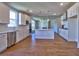 Bright, open kitchen boasts a central island, stainless steel appliances, and hardwood floors at 3745 Reserve Overlook (#30) Way, Cumming, GA 30041