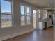 Kitchen with stainless appliances, granite countertops, and large windows overlooking the backyard at 3745 Reserve Overlook (#30) Way, Cumming, GA 30041