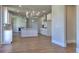 Modern kitchen with an island, white cabinets, and an open floor plan at 3745 Reserve Overlook (#30) Way, Cumming, GA 30041