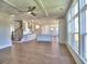 Modern kitchen with white cabinets, an island, and hardwood floors at 3745 Reserve Overlook (#30) Way, Cumming, GA 30041