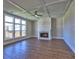 Living room with hardwood floors, fireplace, and large windows at 3745 Reserve Overlook (#30) Way, Cumming, GA 30041