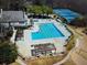 Aerial view of community pool, tennis courts, and amenities near clubhouse at 4515 N. Slope Cir, Marietta, GA 30066