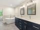 Modern bathroom featuring double sinks, sleek fixtures, and a luxurious soaking tub at 4515 N. Slope Cir, Marietta, GA 30066