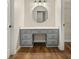 Bathroom vanity area with many drawers, white countertop, mirror and wood flooring at 4515 N. Slope Cir, Marietta, GA 30066