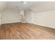 Bonus room featuring wood flooring, staircase, and multiple entry doors at 4515 N. Slope Cir, Marietta, GA 30066