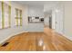 Bright breakfast nook with hardwood floors and views of the kitchen and backyard at 4515 N. Slope Cir, Marietta, GA 30066