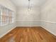 Elegant dining room with hardwood floors, chandelier, and ample natural light at 4515 N. Slope Cir, Marietta, GA 30066