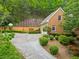 Long private driveway, landscaping and mature trees surround the exterior of this home at 4515 N. Slope Cir, Marietta, GA 30066
