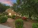 Brick home with attached garage and beautifully landscaped front yard with mature trees at 4515 N. Slope Cir, Marietta, GA 30066