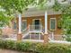 Stately brick home featuring a covered front porch with prominent white columns at 4515 N. Slope Cir, Marietta, GA 30066