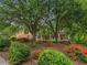 Charming brick home nestled among mature trees, shrubs and colorful flower beds at 4515 N. Slope Cir, Marietta, GA 30066
