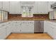 Kitchen featuring granite countertops, stainless steel appliances, and white cabinets at 4515 N. Slope Cir, Marietta, GA 30066