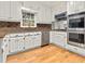 Eat-in kitchen featuring granite countertops, stainless steel appliances, and white cabinets at 4515 N. Slope Cir, Marietta, GA 30066