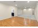 Spacious living room with hardwood floors, recessed lighting, and an adjacent bathroom at 4515 N. Slope Cir, Marietta, GA 30066