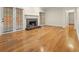 Bright living room with a stone fireplace, hardwood floors, and glass doors leading to the outside at 4515 N. Slope Cir, Marietta, GA 30066