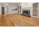 Cozy living room featuring a stone fireplace, hardwood floors, and natural light at 4515 N. Slope Cir, Marietta, GA 30066