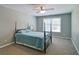 Serene bedroom with a four-poster bed, cozy carpeting, and ample natural light from the window at 5800 Villa Rica Hwy, Dallas, GA 30157