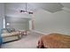 Large bonus room featuring soft carpet, vaulted ceilings, and a cozy living area with couches at 5800 Villa Rica Hwy, Dallas, GA 30157