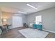Versatile bonus room with a large rug, stylish decor, and abundant natural light at 5800 Villa Rica Hwy, Dallas, GA 30157