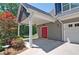 An eye-catching red door nestled within a welcoming carriage and beautiful landscaping at 5800 Villa Rica Hwy, Dallas, GA 30157