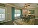 Bright dining room with natural light, a wooden table set for four, and calming green accents at 5800 Villa Rica Hwy, Dallas, GA 30157