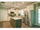 Open kitchen featuring stainless steel appliances, a kitchen island, and ample counter space at 5800 Villa Rica Hwy, Dallas, GA 30157