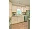 Close-up view of kitchen with stainless steel appliances, granite countertops, and wood-look flooring at 5800 Villa Rica Hwy, Dallas, GA 30157