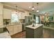 Modern kitchen featuring stainless steel appliances, an island with seating, and ample cabinet space at 5800 Villa Rica Hwy, Dallas, GA 30157
