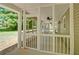 Spacious screened porch provides an airy, protected space with ceiling fan and open views at 5800 Villa Rica Hwy, Dallas, GA 30157