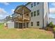 View of backyard and elevated deck on a sunny day with a blue sky at 1225 Westshore Dr, Cumming, GA 30041